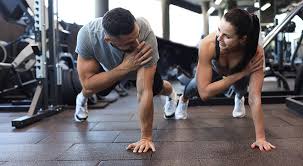 Toning Bingo Wings: Your Ultimate Guide to Sculpting Sleek Arms at the Gym 3 Fitness trainer demonstrating arm toning exercises Wellingborough