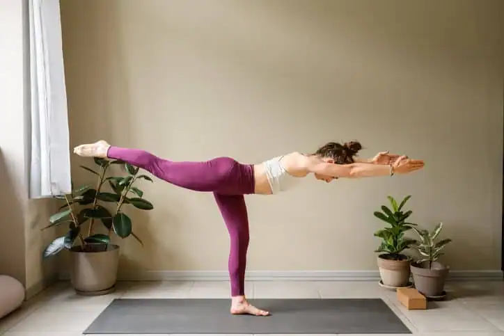 Achieving the Perfect Tone: How Often Should You Exercise for Results? 1 Woman doing Yoga exercise Wellingborough to help with toning the body.